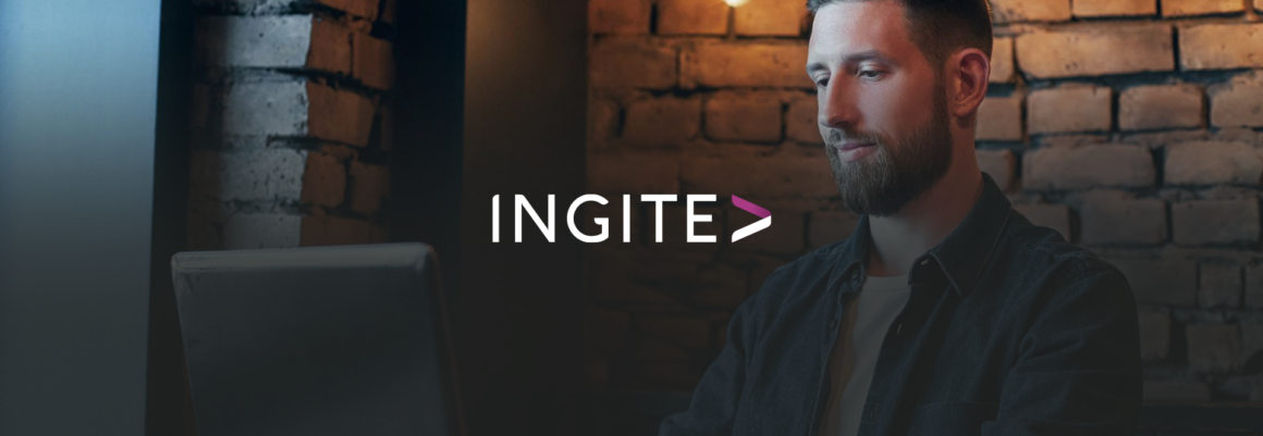 Employee working at a computer in a dimly lit office